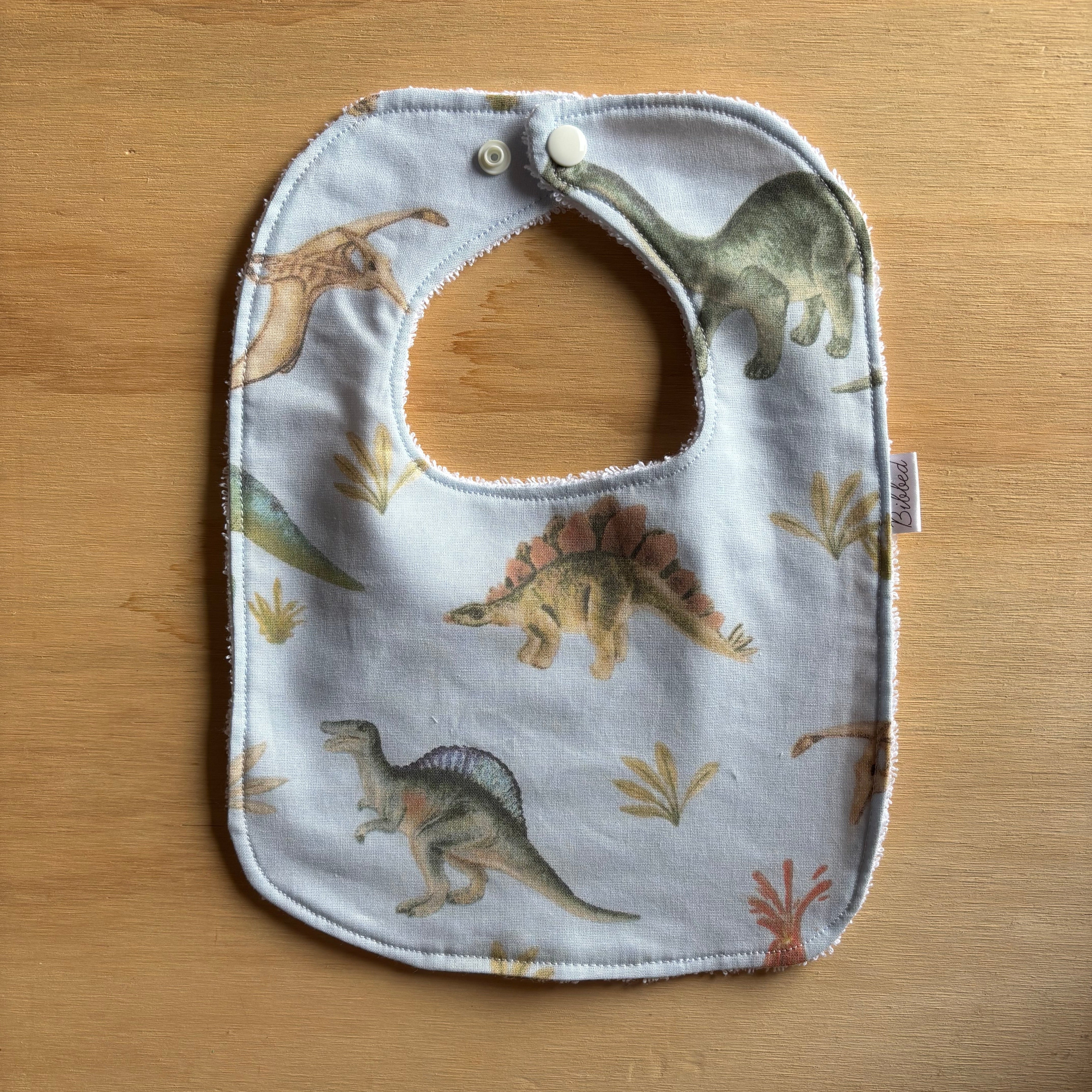 Light Blue Dinosaurs Dinner Bib